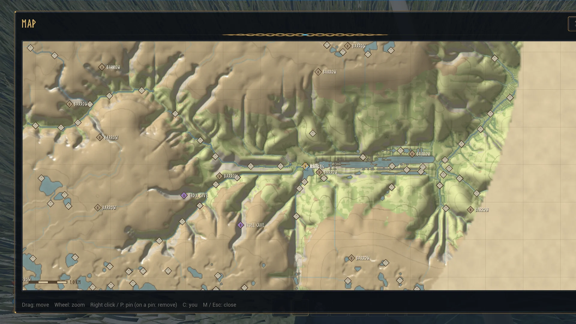 The world map: a parchment drawing of valleys, rivers and lakes with marked barrows, troll caves and a legend