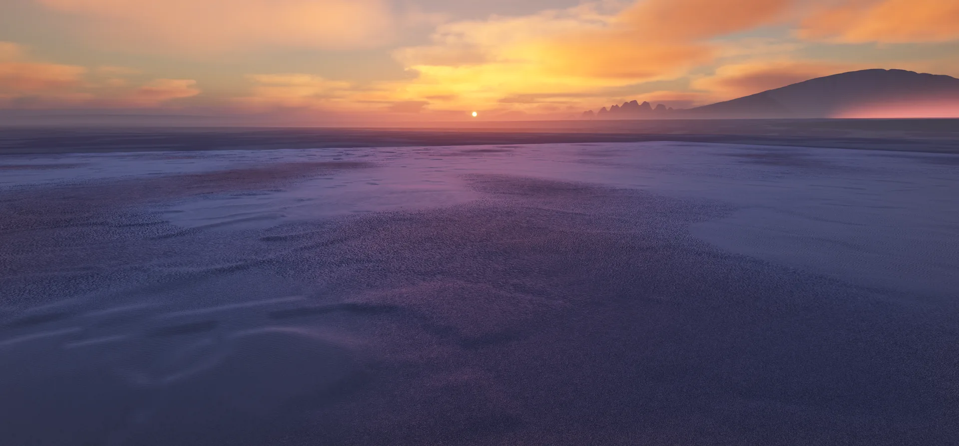 The sun touching the horizon over the open sea, painting the clouds and distant mountain peaks gold and rose